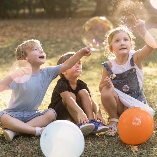 full-shot-kids-playing-outdoors